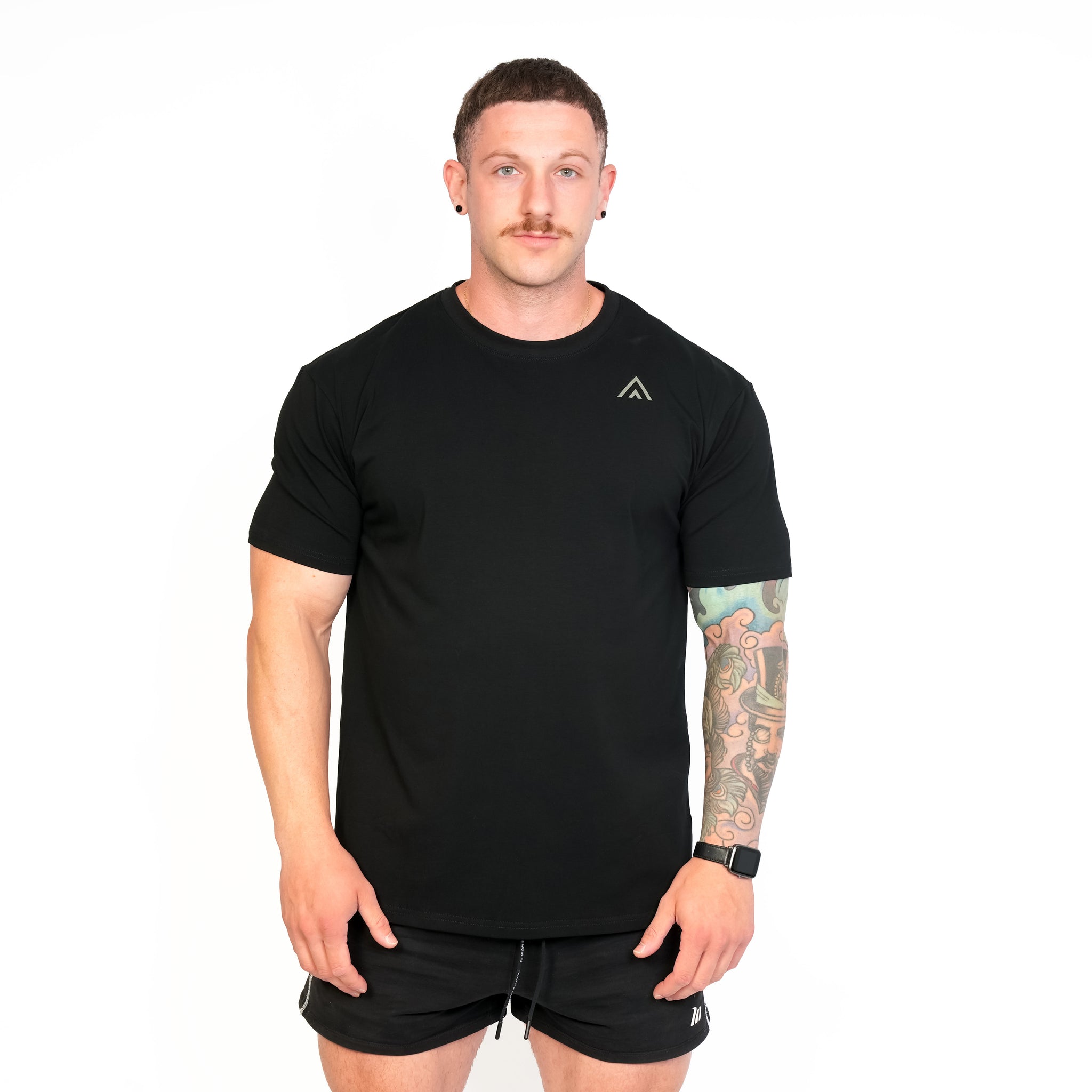 Front view of man wearing black colour Top Athlete unisex activewear t-shirt.