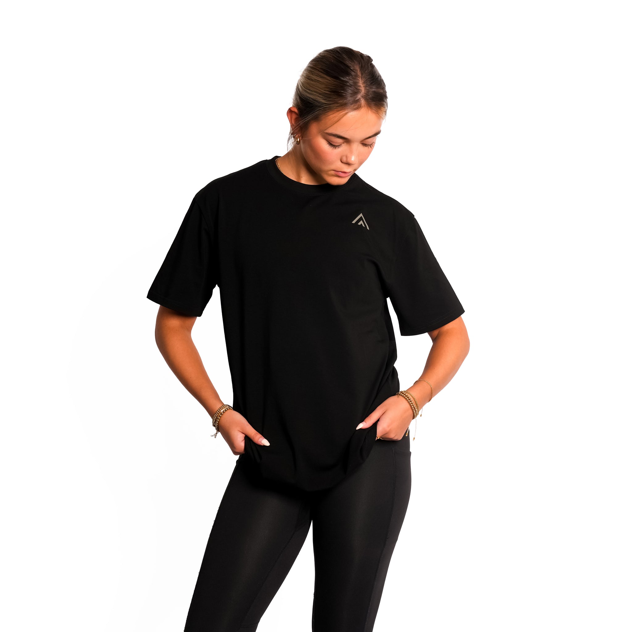 Front view of woman wearing black colour Top Athlete unisex oversized activewear t-shirt.