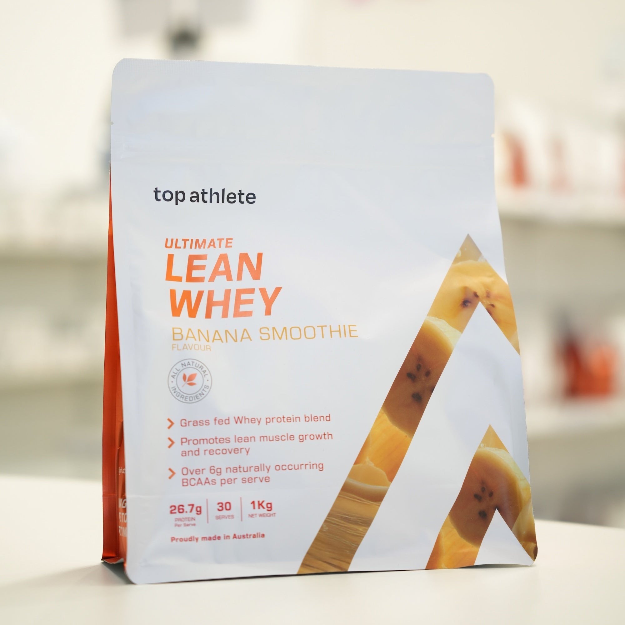 Top Athlete Lean Whey protein package on a blurred background
