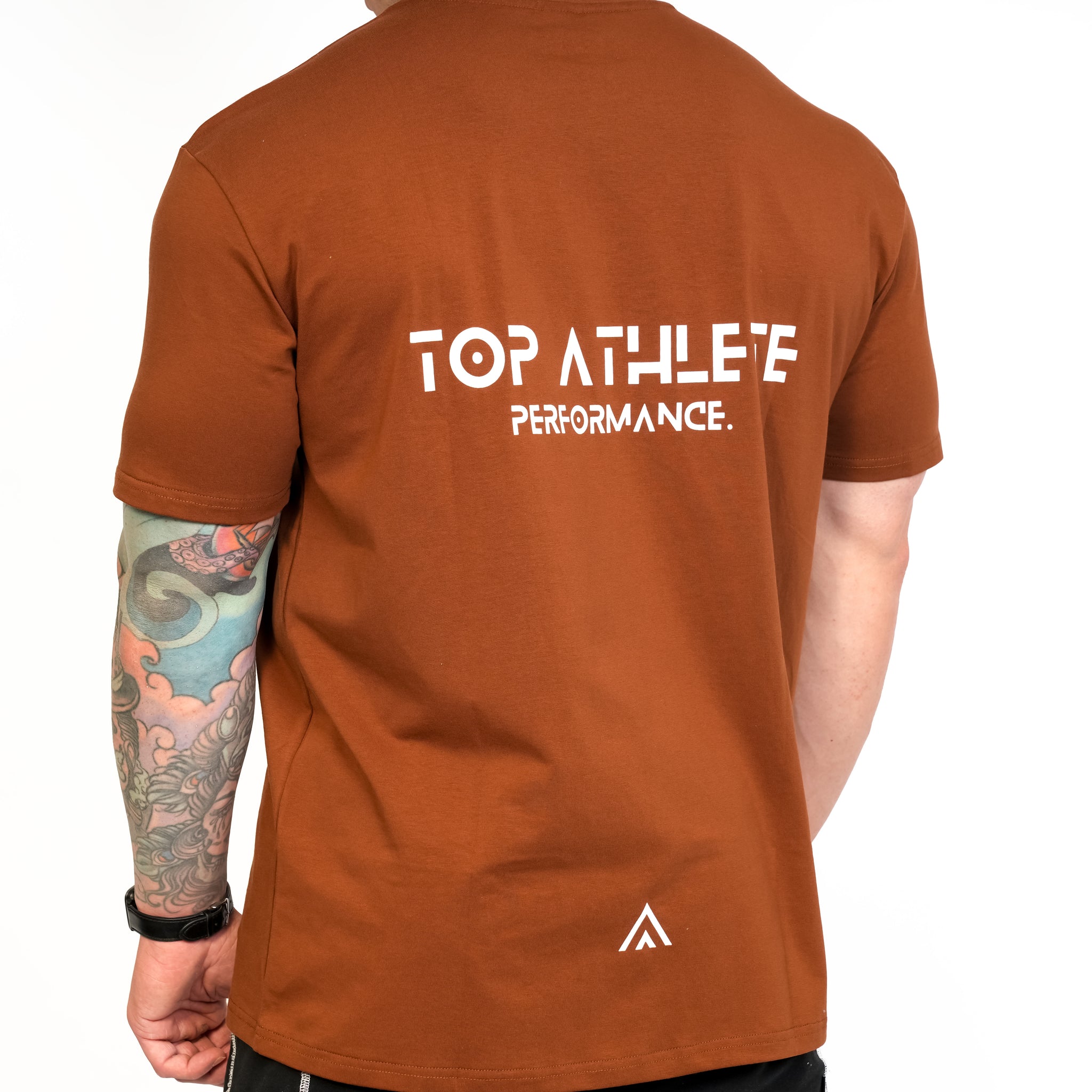 Back view of man wearing bronze colour Top Athlete unisex activewear t-shirt.