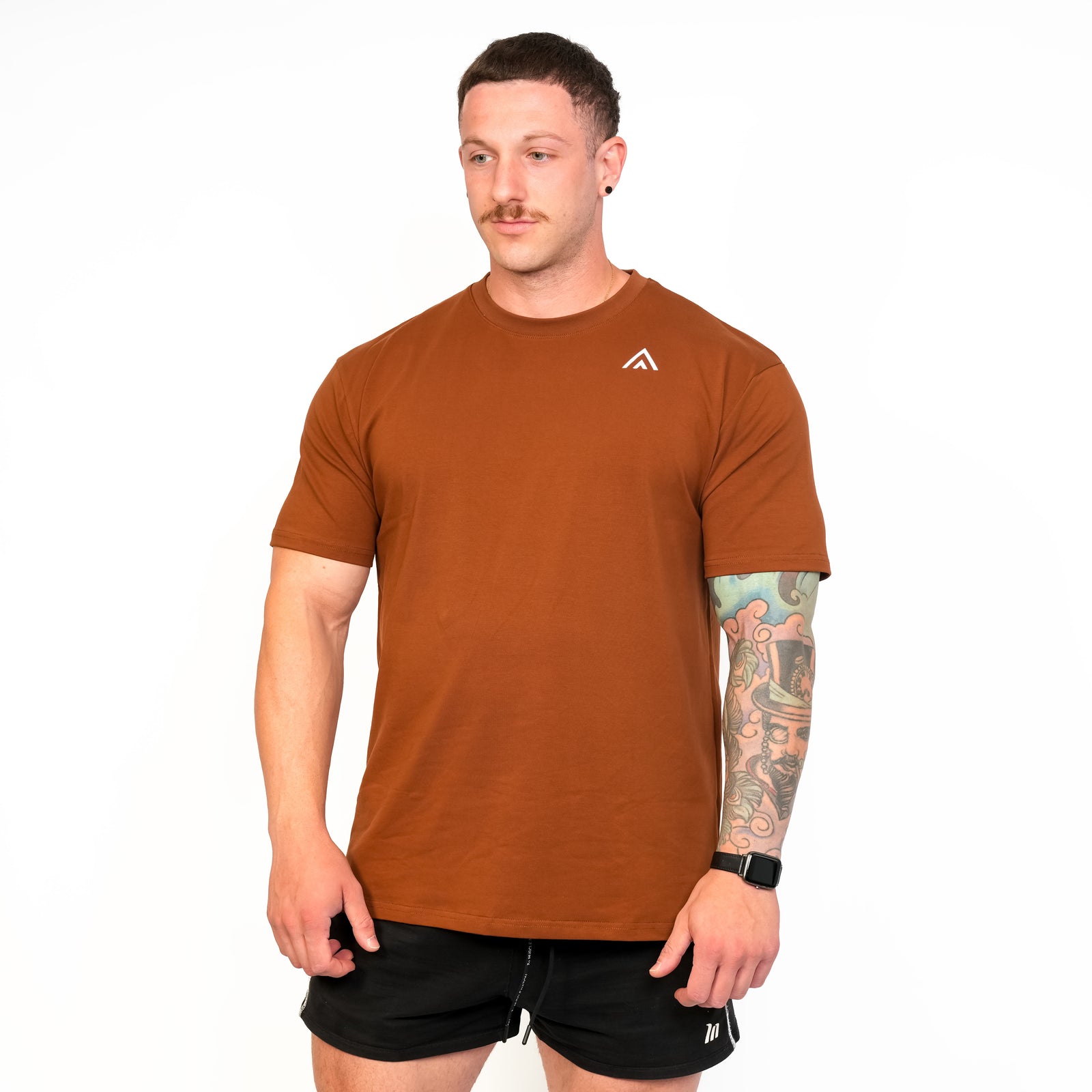Front view of man wearing bronze colour Top Athlete unisex activewear t-shirt.